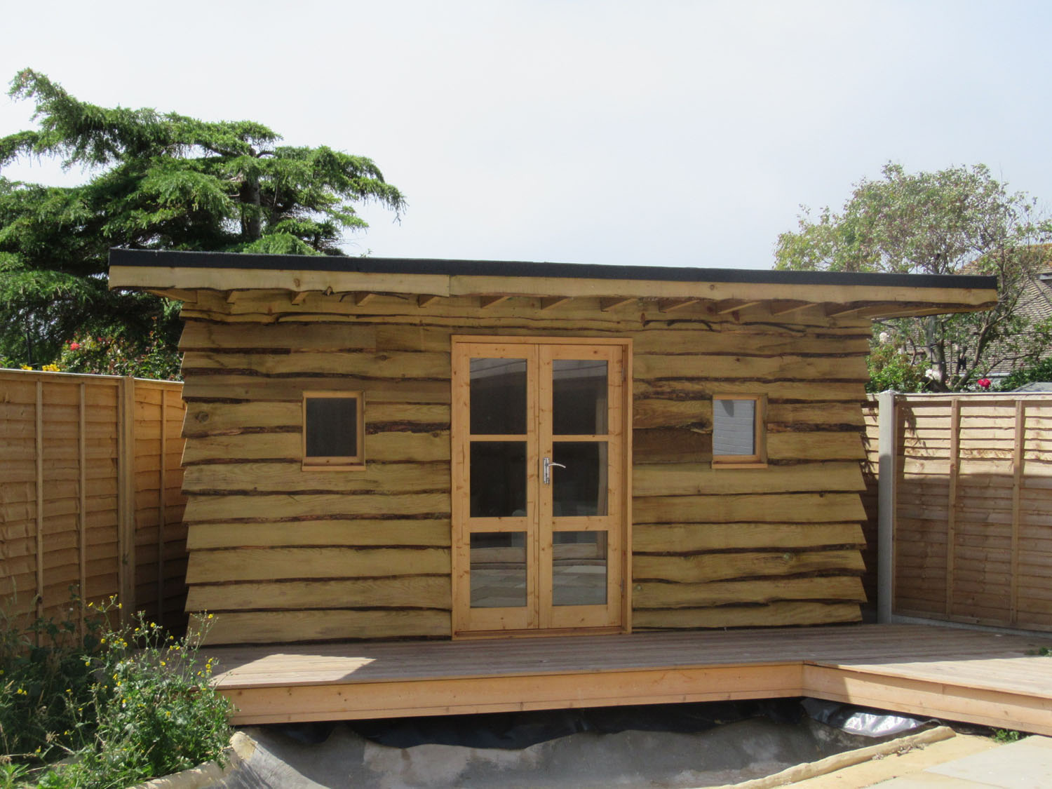 Waney edge boarded shed